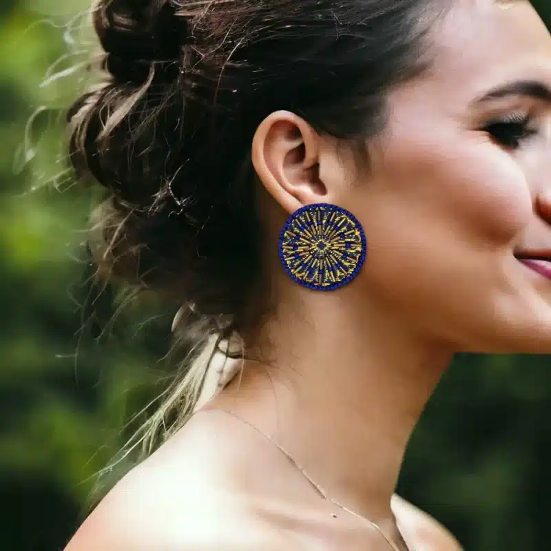 handmade blue Sun Earring on a woman ear