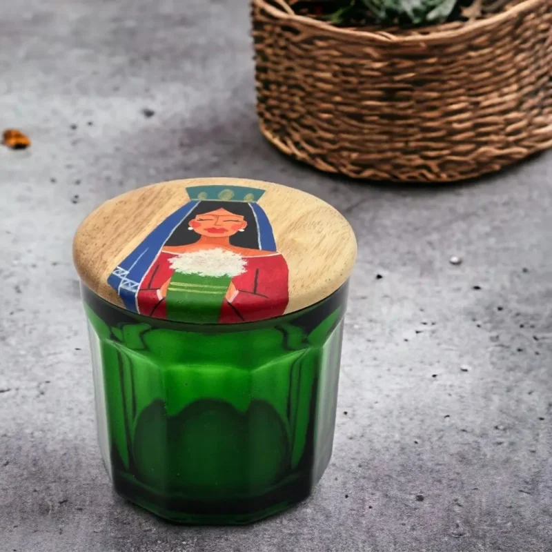 green jar and wooden lid with hand painting