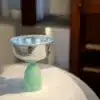 copper and green glass bowl